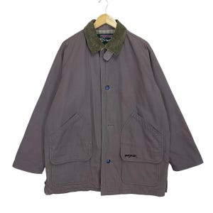 May include: A brown corduroy jacket with a green corduroy collar and a navy blue logo that says "Jaysport" on the left pocket.