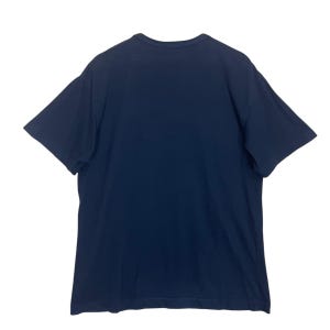 May include: A navy blue short-sleeved t-shirt.