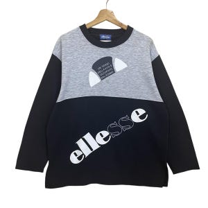 Choisissez !! vintage des années 90 Ellesse gros logo épellation pull à col rond Ellesse pull Ellesse pull gros logo pull taille M