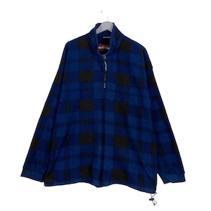 May include: A blue and black plaid fleece pullover with a quarter-zip closure. The long-sleeved shirt hangs on a wooden hanger. The garment has a high collar and a drawstring at the bottom hem.