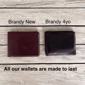 May include: Two leather wallets, one burgundy and one dark brown, are shown. The burgundy wallet is labelled "Brandy New," and the dark brown wallet is labelled "Brandy 4yo." The text "All our wallets are made to last" is at the bottom.