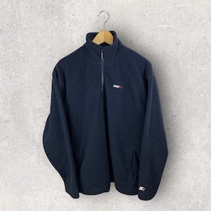 May include: A black fleece pullover with a quarter zip closure. The pullover has the word "STARTER" embroidered on the chest in red and white.