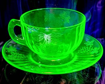 Vintage Hazel Atlas Uranium Pressed Glass Fruits Cup And Fruits Saucer Set. One Set Is One Cup And One Saucer C. 1930's