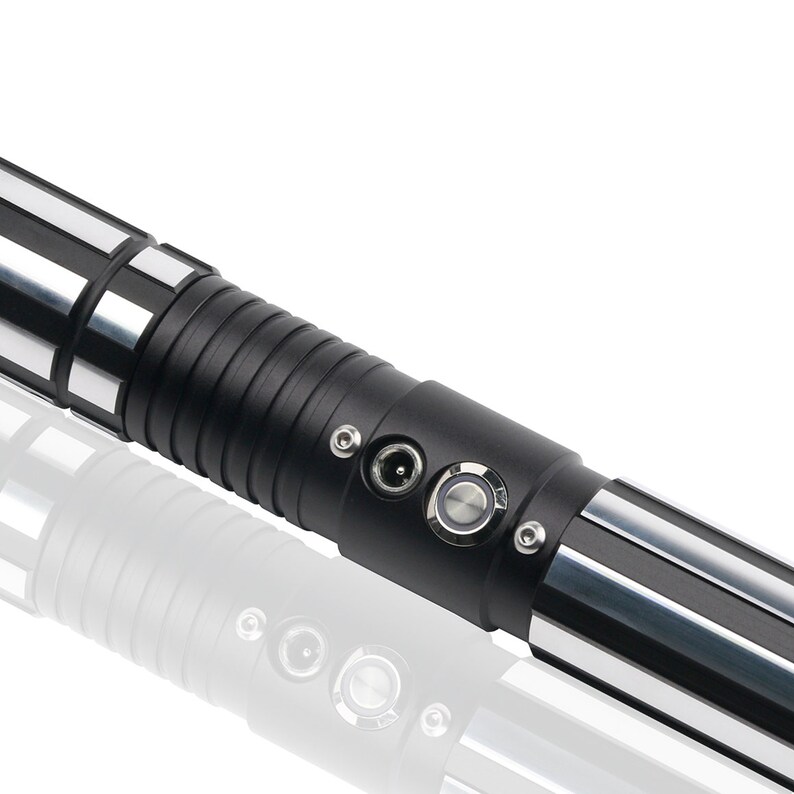 May include: A black and silver lightsaber with a textured grip and a power button and charging port.