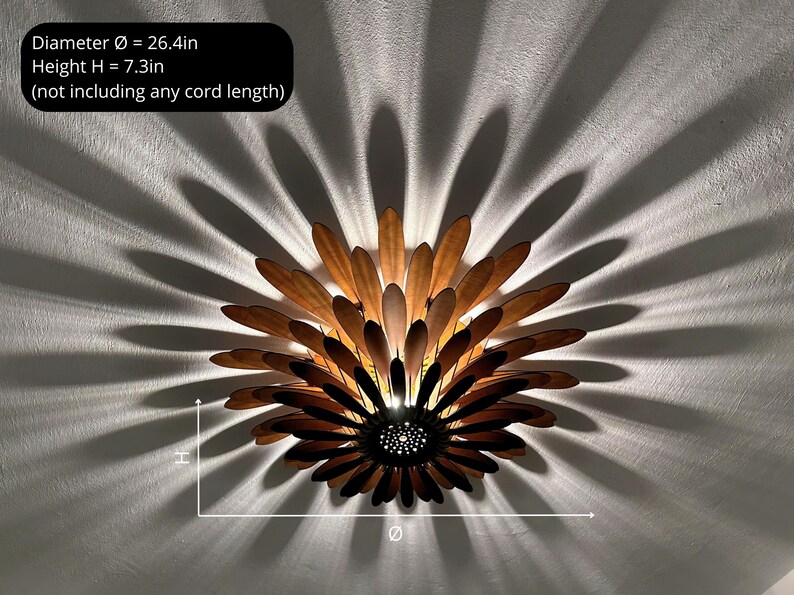 May include: A wooden ceiling light fixture shaped like a flower with brown and light brown petals. The light fixture is 26.4 inches in diameter and 7.3 inches tall.  The light fixture is mounted on a white ceiling.