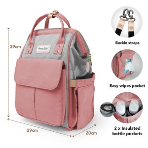 May include: A pink and gray diaper bag with a large front pocket, two side pockets, and two insulated bottle pockets. The bag has adjustable buckle straps and a zippered top closure. It measures 15.3 inches tall, 11.4 inches wide, and 7.9 inches deep.