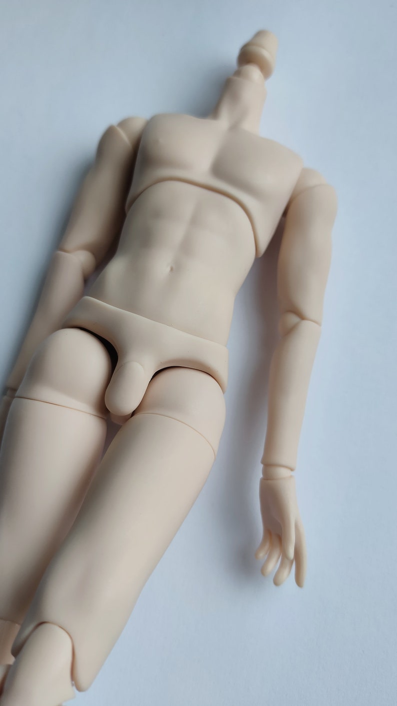 May include: A nude-colored doll body with jointed limbs and a simple underwear garment.