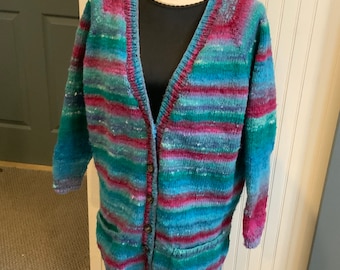 Size large cardigan Hand knit in stockinette stitch. Noro kureopatora yarn. Warm and cozy.