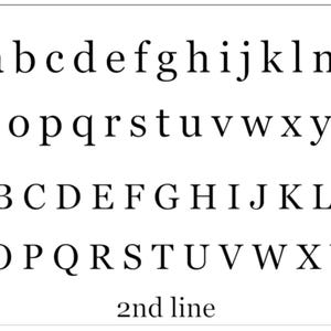 May include: A white background displays black lowercase and uppercase alphabets in a serif font. The letters are arranged in rows, with the text "2nd line" at the bottom.