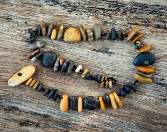 Dark surfer bracelet with striped black pebbles. Summer jewelry made of rare natural sea stone finds. Friendship gift.