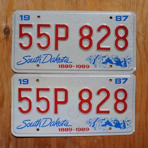 ONE or MORE - 1987 South Dakota Centennial Mt Rushmore  License Plate Set / Pair - Mint Excellent Unused Original