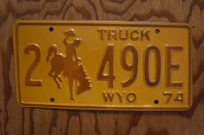 1974 Wyoming Cowboy Horse Yellow License Plate # 2-490E