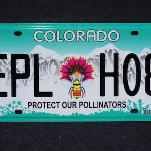 May include: A turquoise blue Colorado license plate with the text "Protect Our Pollinators" and a bee illustration. The license plate number is "EPL H08".