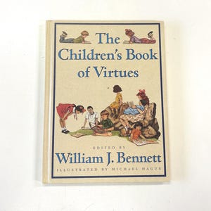May include: A hardcover book titled "The Children's Book of Virtues" with illustrations of children reading. The cover features a beige background with blue and brown text and illustrations. Edited by William J. Bennett, illustrated by Michael Hague.