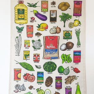 May include: A beige tea towel featuring a colorful illustration of various foods and spices, with the word "BANGLADESH" at the top. The design includes images of vegetables, fruits, and packaged goods, with text labels in both English and Bengali.