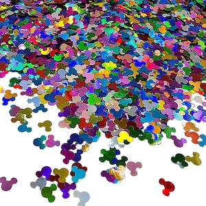 May include: A large collection of small, holographic confetti pieces shaped like mouse heads in a vibrant array of colours including red, blue, green, purple, yellow, and silver. The individual pieces are scattered across the frame.