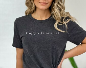 Trophäe Frau Material Unisex Jersey Kurzarm T-Shirt