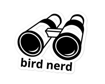 May include: Black and white sticker with a pair of binoculars and the text "bird nerd".