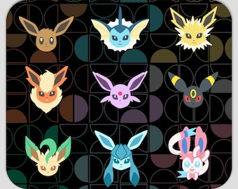 May include: A rectangular mouse pad featuring a black background with a repeating pattern of dark geometric semi-circles. The surface displays nine stylized character heads, including Eevee and its various evolutions in vibrant colors.