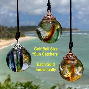 Cremated ashes in glass Sun Catcher (Colors: Peacock/Earth Tones/Gold) Lifetime ashes to ashes glass keepsake. Also, cremains in pendants.
