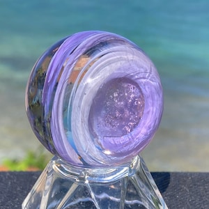 Cremated ashes in glass Sun Catcher (Color: 2 Purples)  A Lifetime ashes to ashes glass keepsake. Also, ash remains in pendants & turtles.