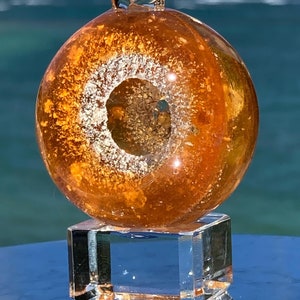 Cremated ashes in glass Sun Catcher (Opaque Orange) memorial. Lifetime ashes to ashes glass keepsake. Cremains in pendants w/without opals