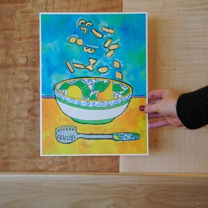 May include: A watercolour painting of a bowl of pasta with various types of pasta falling from the sky. The bowl is decorated with lemons and green leaves. The text "orecchiette", "cavatelli", "fusilli", "linguine", "farfalle", "penne", "spaghetti", "conchiglie" is written around the pasta.