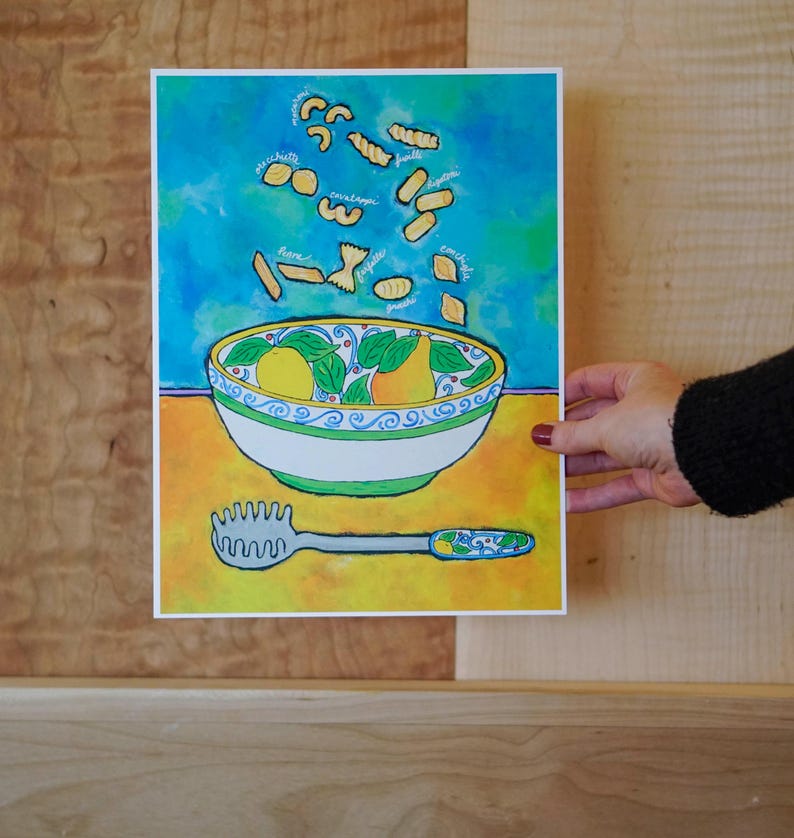 May include: A watercolour painting of a bowl of pasta with various types of pasta falling from the sky. The bowl is decorated with lemons and green leaves. The text "orecchiette", "cavatelli", "fusilli", "linguine", "farfalle", "penne", "spaghetti", "conchiglie" is written around the pasta.