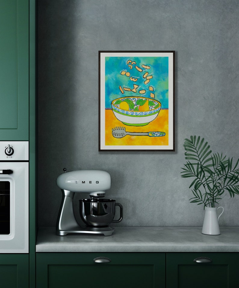 May include: A framed illustration of a bowl of pasta with a yellow background and a blue and green patterned bowl. The pasta is flying out of the bowl and there is a pasta server on the table.