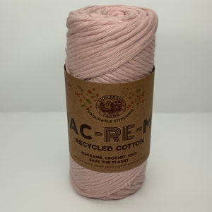 May include: A pink ball of Lion Brand AC-RE-M Recycled Cotton yarn. The label reads "Sustainable Stitching" and "Save the Planet".