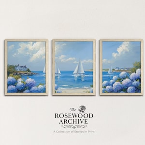 May include: Set of three framed art prints depicting coastal scenes with sailboats, blue hydrangeas, and a house. The paintings are in a light, airy style with a focus on the ocean and sky. The frames are a light wood color. The Rosewood Archive logo is at the bottom.