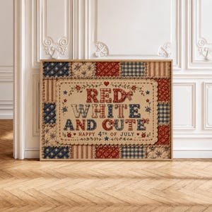 May include: Framed artwork with a patriotic theme. The artwork features the text "RED WHITE AND CUTE" with a decorative border and the phrase "HAPPY 4TH OF JULY." The background is a patchwork design in red, white, and blue.