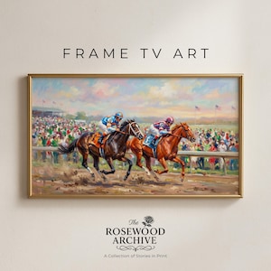 May include: A framed painting of a horse race with two horses in the lead, jockeys in colorful silks, and a crowd in the background. The frame is gold, and the text "FRAME TV ART" is at the top.