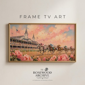 May include: A framed painting of a horse race with jockeys in colorful silks. The artwork features a vibrant pink and peach sky, a lush green track, and a foreground of pink flowers. The frame is gold, and the text "FRAME TV ART" is at the top.