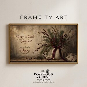 May include: A framed print with a gold border. It features a floral arrangement with red berries and greenery in a white vase tied with a burgundy ribbon. The text reads "Glory to God in the Highest and on Earth, Peace."