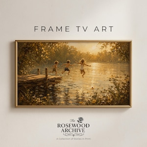 May include: A framed print titled "FRAME TV ART" depicts three children jumping into a lake from a wooden dock. The artwork has a warm, golden color palette, with the text "The Rosewood Archive" and "A Collection of Stories in Print" at the bottom.
