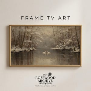 May include: A framed landscape painting featuring a serene winter scene with snow-covered trees lining a calm river. Two swans are reflected in the water. The text "FRAME TV ART" is at the top.