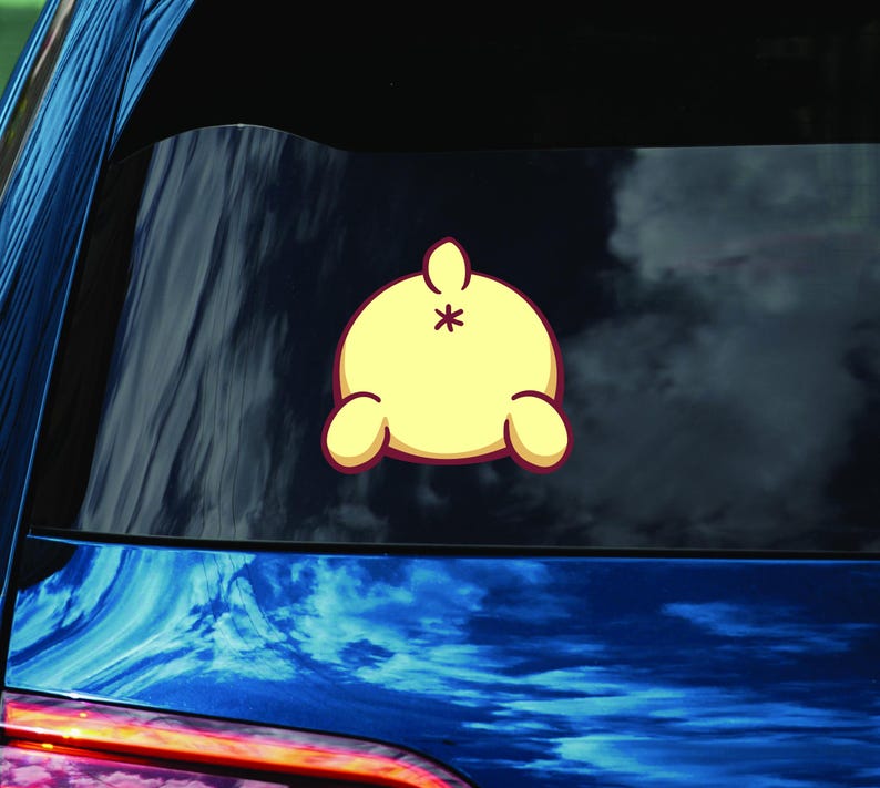 May include: A yellow cartoon character with a red outline, viewed from behind, with a tail and two small arms. The character is facing away from the viewer.