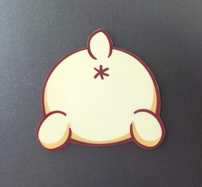 May include: A white cartoon bunny with a brown outline, viewed from behind. The bunny has a small tail and two small ears.