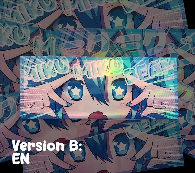 May include: Holographic sticker featuring a stylized anime character with blue hair and large blue eyes with star-shaped pupils. The text "MIKU MIKU DREAM" is overlaid. The sticker has a Version B: EN label.