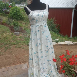 Gorgeous 1960/70 boho floral sun dress, (same style as Gunne Sax).  Lace sleeves, ribbon waist, size small, blue and cream color