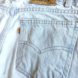 Vintage 1990s light wash orange tag Levi Jeans. women&#39;s small. exact measurements in item description. excellent condition!