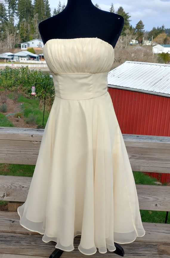1960s style fit and flare pale yellow dress, strap