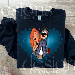 May include: A navy blue sweatshirt with a graphic print of a cartoon couple in a heart-shaped frame. The couple is dressed in casual clothing and has a blue and teal background.