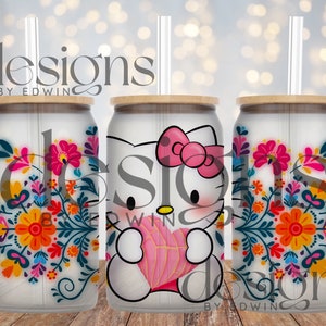 May include: Three white stainless steel tumblers with a wood lid and clear straw. The tumblers feature a colourful floral design and a Hello Kitty character holding a pink heart. The text "designs by edwin" is on the tumblers.