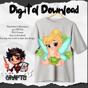 May include: A digital illustration of a cartoon Tinkerbell fairy with blonde hair and blue eyes. She is wearing a green dress and has wings. She is holding a pastry in her hand. The image is on a gray t-shirt.