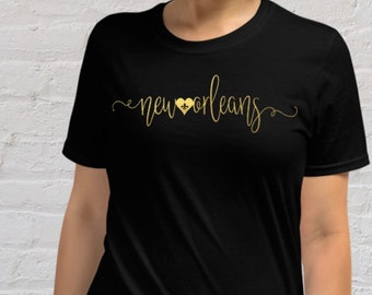 Saints Shirt New Orleans Black and Gold Script Typography with Fleur de Lis Heart Womens Short Sleeve Tee | Nola Gifts | Louisiana Tshirt