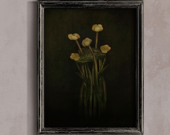 May include: A framed wall art piece featuring a dark, moody painting of a small bouquet of yellow buttercup flowers with green stems and leaves. The artwork is enclosed in a rectangular, distressed black wooden frame with a textured finish.