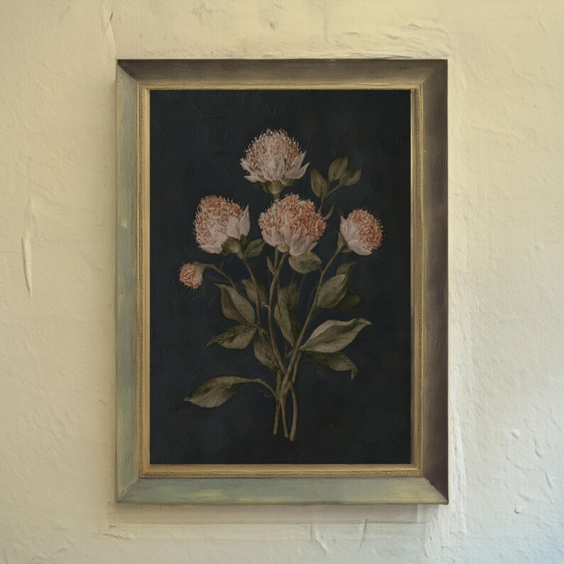 May include: A framed floral print featuring a bouquet of pink and white flowers with green leaves against a dark blue background. The frame has a distressed, muted green and gold finish, adding a vintage aesthetic.