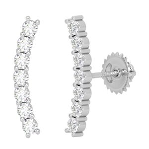 May include: A pair of silver-toned stud earrings. Each earring features a curved row of seven round, clear gemstones. The earrings have a post and backing for secure wear. The gemstones are set in a channel setting.